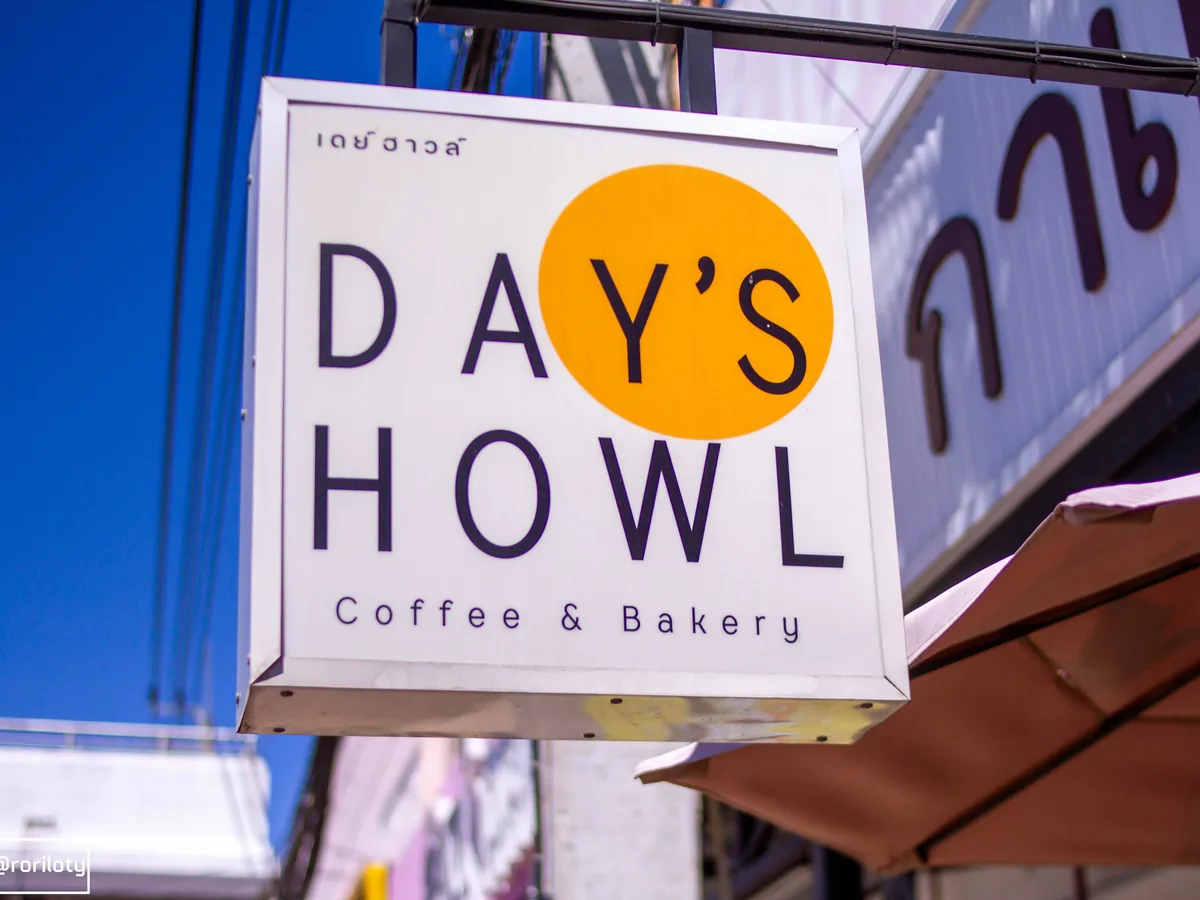 A glowing café sign at night